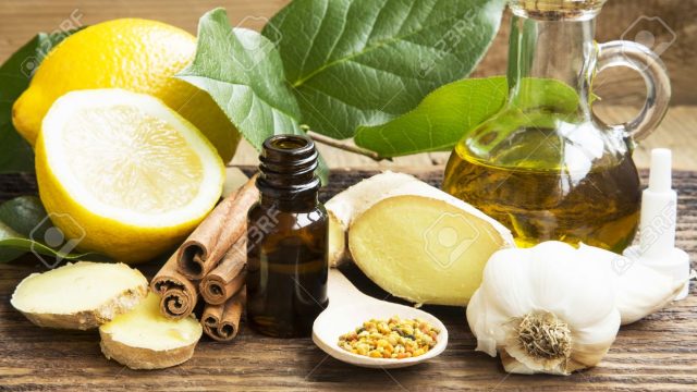 37727132-alternative-medicine-with-lemon-pollen-cinnamon-ginger-and-garlic.jpg