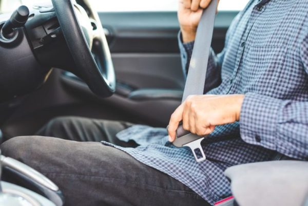 close-up-hands-man-sitting-on-car-seat-and-royalty-free-image-1627570297.jpg