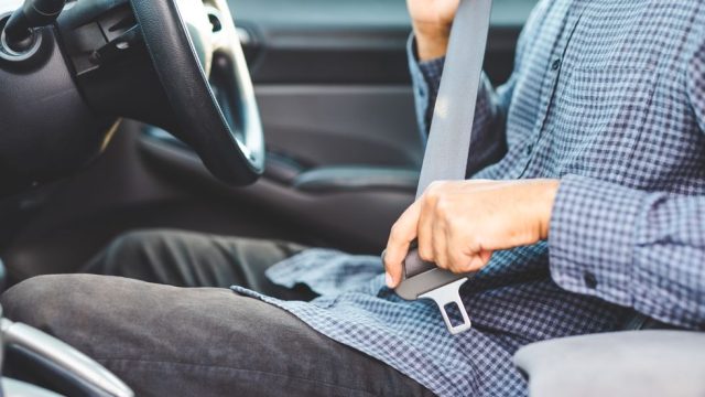 close-up-hands-man-sitting-on-car-seat-and-royalty-free-image-1627570297.jpg