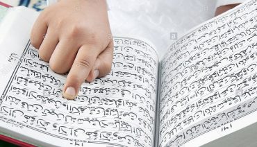 muslim-boy-reading-the-quran-BNJ46N.jpg