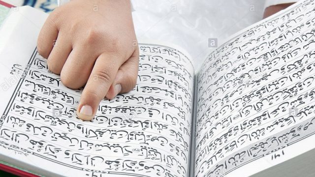 muslim-boy-reading-the-quran-BNJ46N.jpg